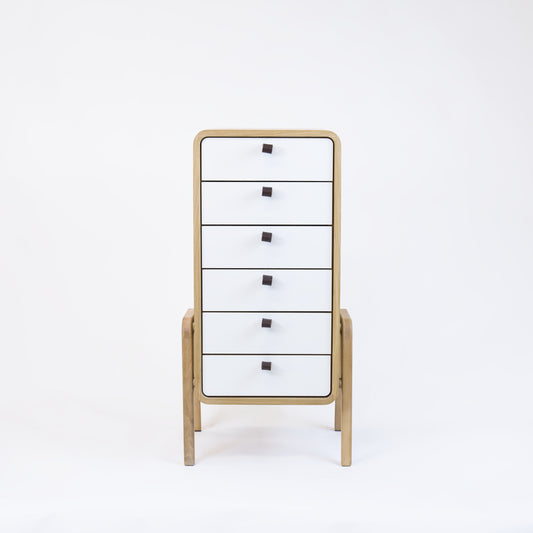 Low drawer unit nm61L. The main corpus is crafted from solid Norwegian oak, featuring 6 drawers with white front.
