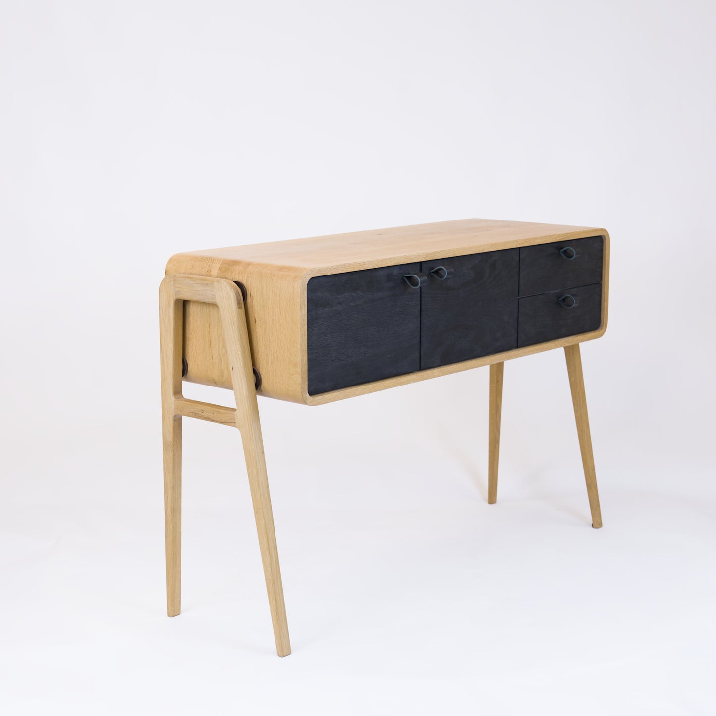 High sideboard nm23H. The main corpus is crafted from solid Norwegian oak, featuring 2 doors and 2 right drawers, all with black oak fronts.