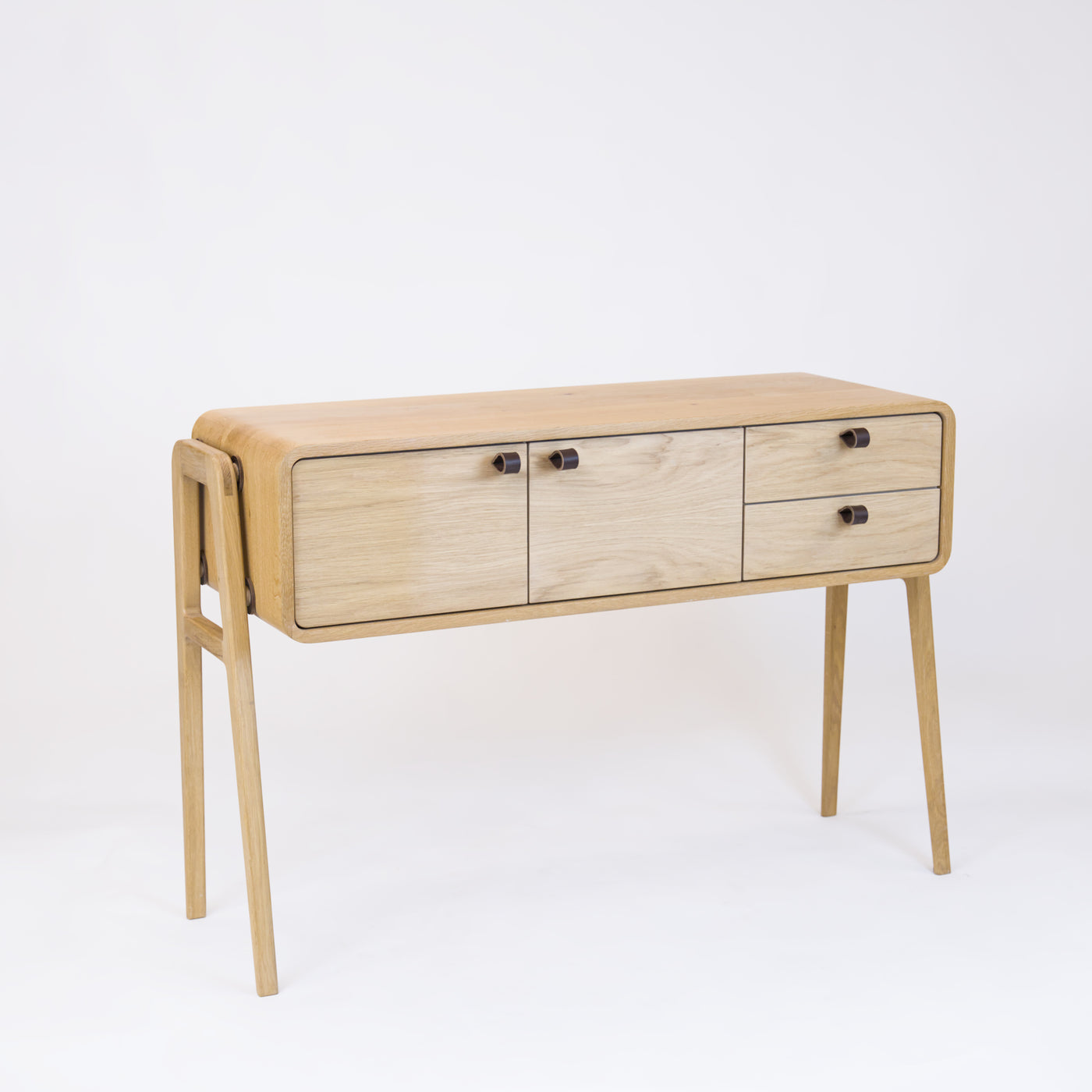 High sideboard nm23H. The main corpus is crafted from solid Norwegian oak, featuring 2 doors and 2 right drawers, all with natural oak fronts.