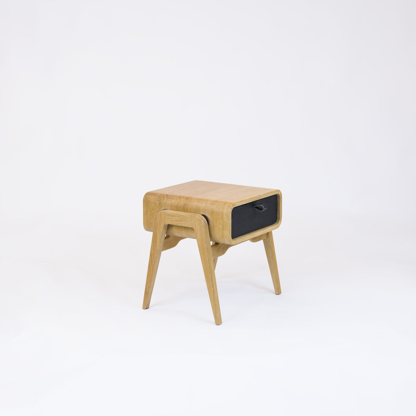 Low desk and storage bench nm11L. The main corpus is crafted from solid Norwegian oak, featuring 1 drawer with black oak front.