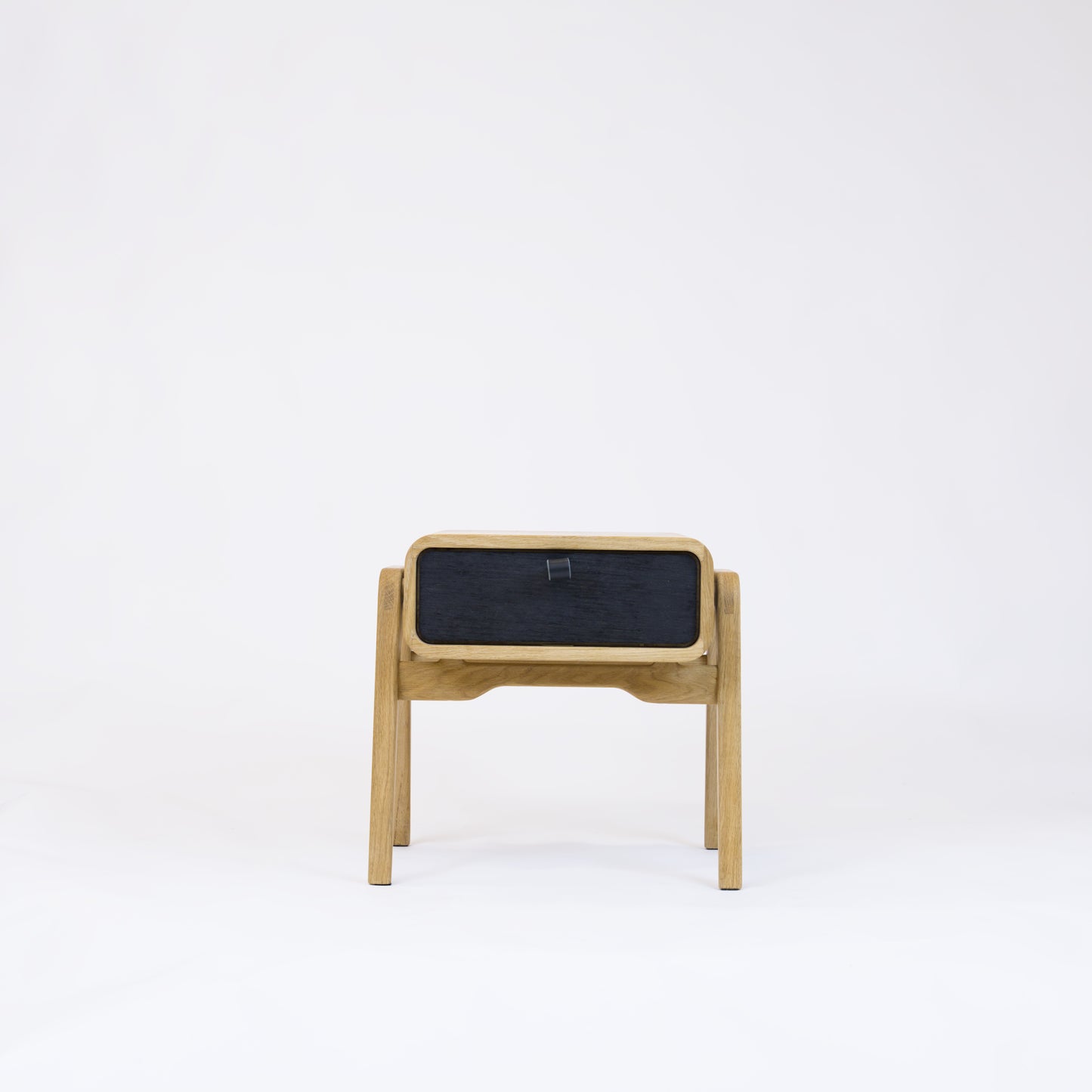 Low desk and storage bench nm11L. The main corpus is crafted from solid Norwegian oak, featuring 1 drawer with black oak front.