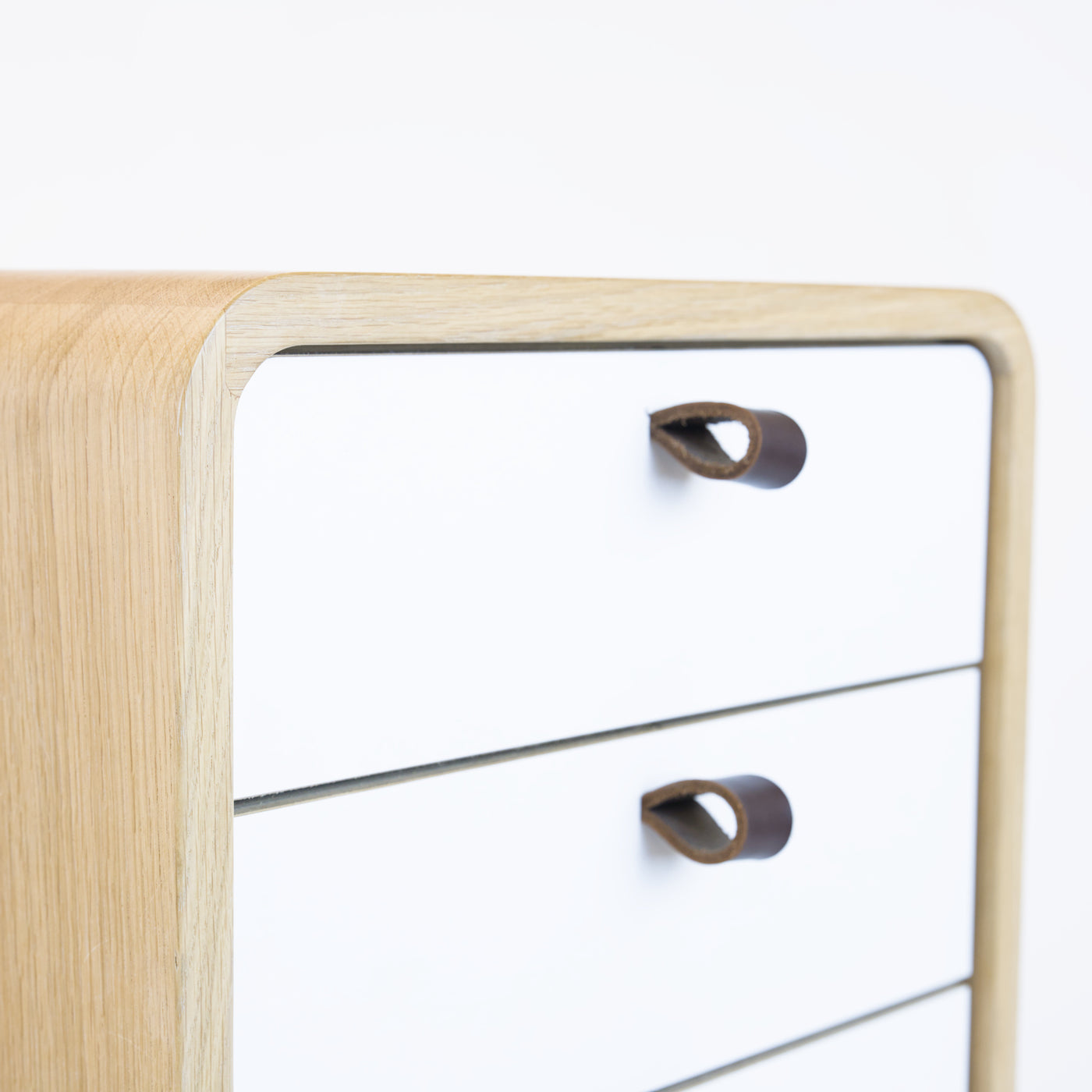 Low drawer unit nm61L. The main corpus is crafted from solid Norwegian oak, featuring 6 drawers with white front.
