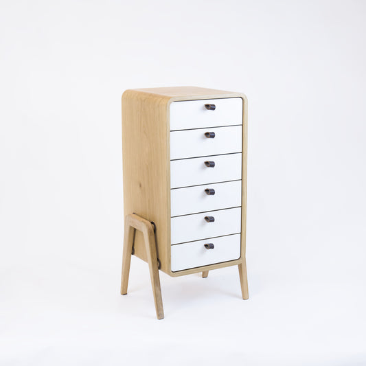 Low drawer unit nm61L. The main corpus is crafted from solid Norwegian oak, featuring 6 drawers with white front.