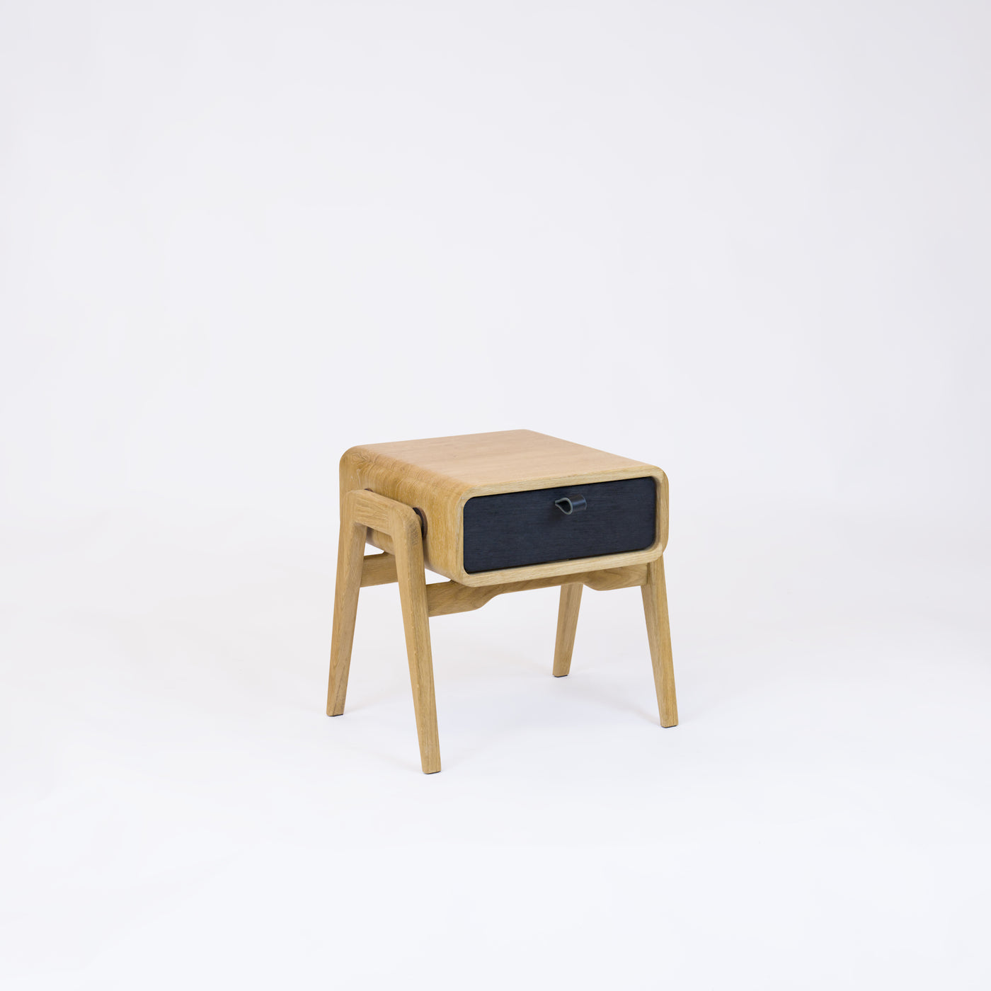 Low nightstand nm11L. The main corpus is crafted from solid Norwegian oak, featuring 1 drawer with black oak front.