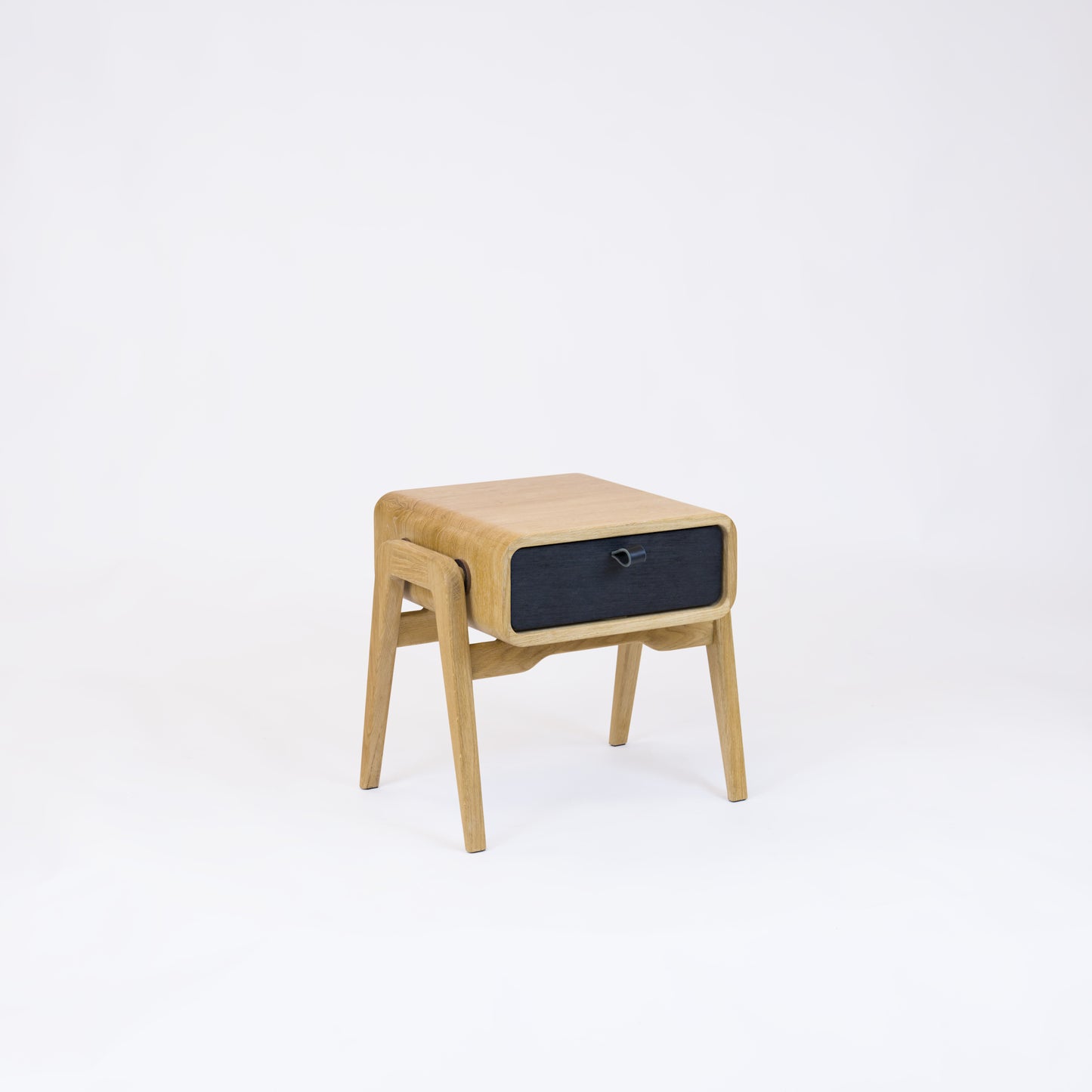 Low nightstand nm11L. The main corpus is crafted from solid Norwegian oak, featuring 1 drawer with black oak front.