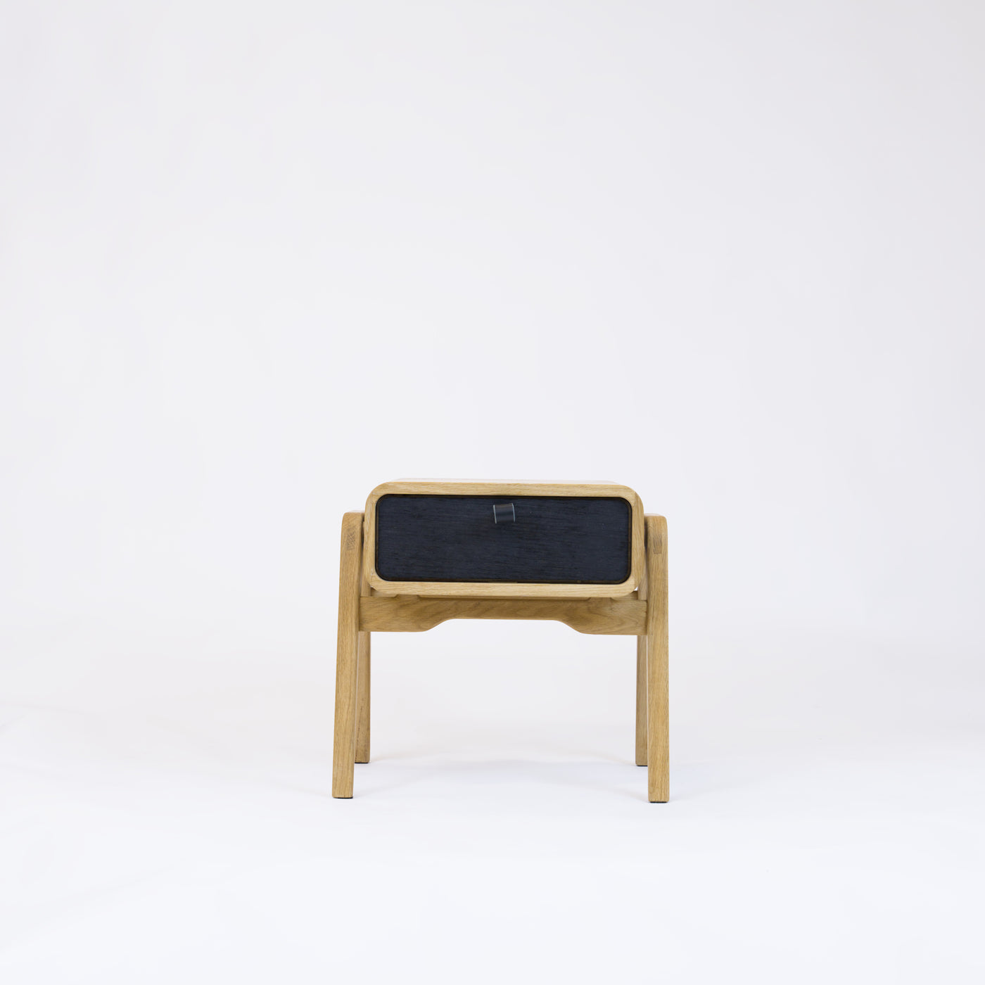 Low nightstand nm11L. The main corpus is crafted from solid Norwegian oak, featuring 1 drawer with black oak front.