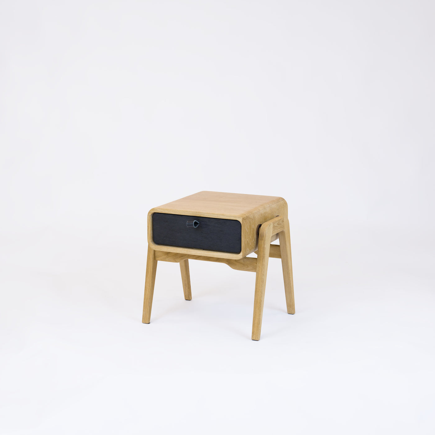 Low nightstand nm11L. The main corpus is crafted from solid Norwegian oak, featuring 1 drawer with black oak front.