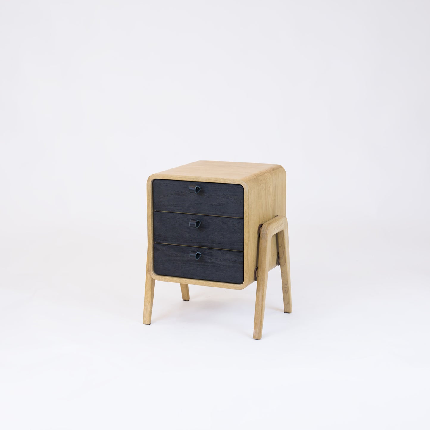 Low nightstand nm31L. The main corpus is crafted from solid Norwegian oak, featuring 3 drawers with black oak front.