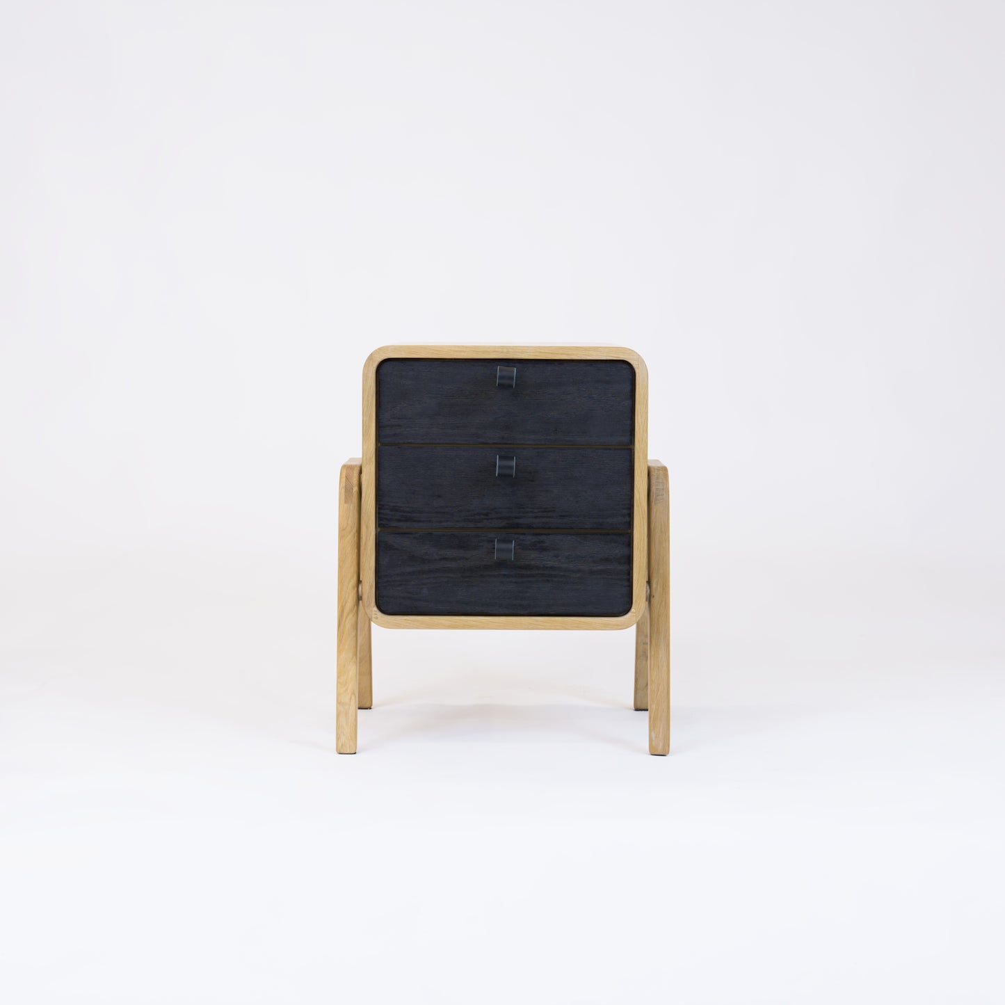 Low nightstand nm31L. The main corpus is crafted from solid Norwegian oak, featuring 3 drawers with black oak front.