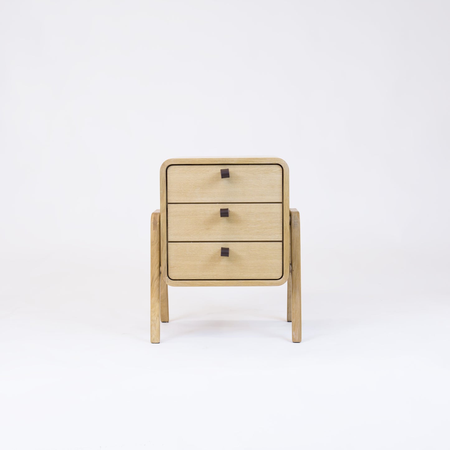 Low nightstand nm31L. The main corpus is crafted from solid Norwegian oak, featuring 3 drawers with natural oak front.