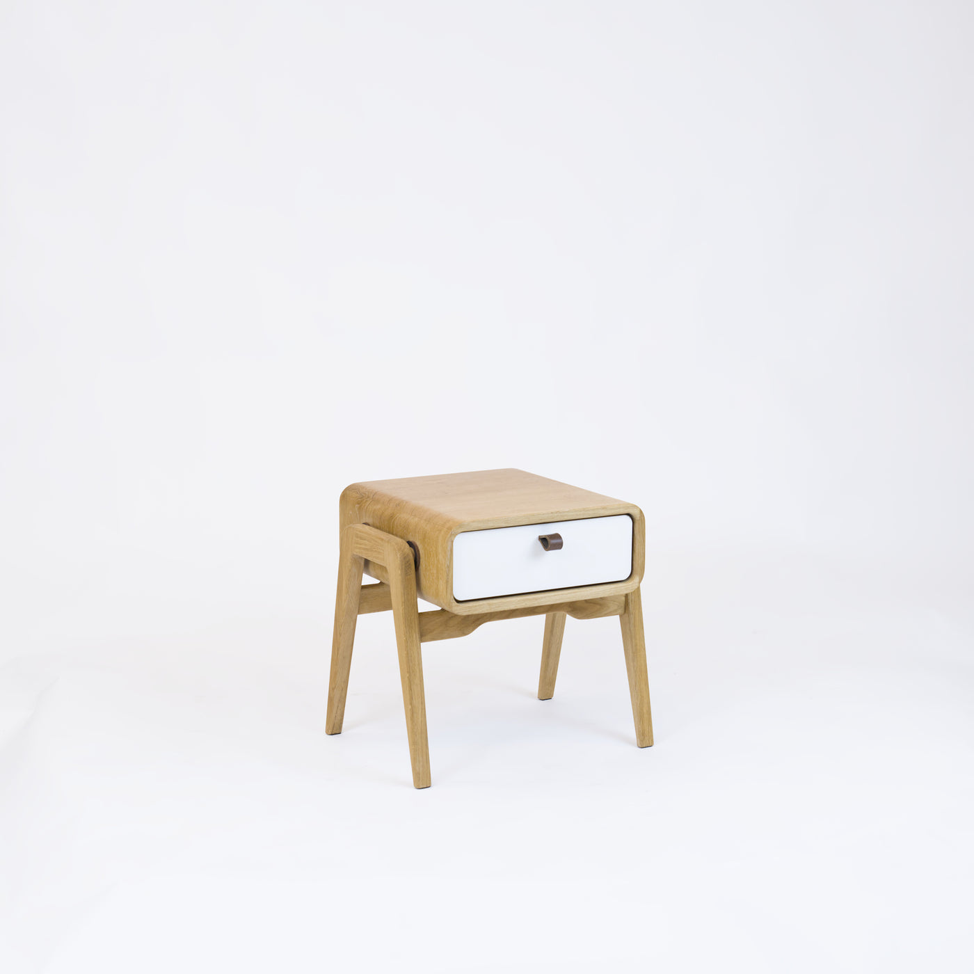 Low nightstand nm11L. The main corpus is crafted from solid Norwegian oak, featuring 1 drawer with white front.