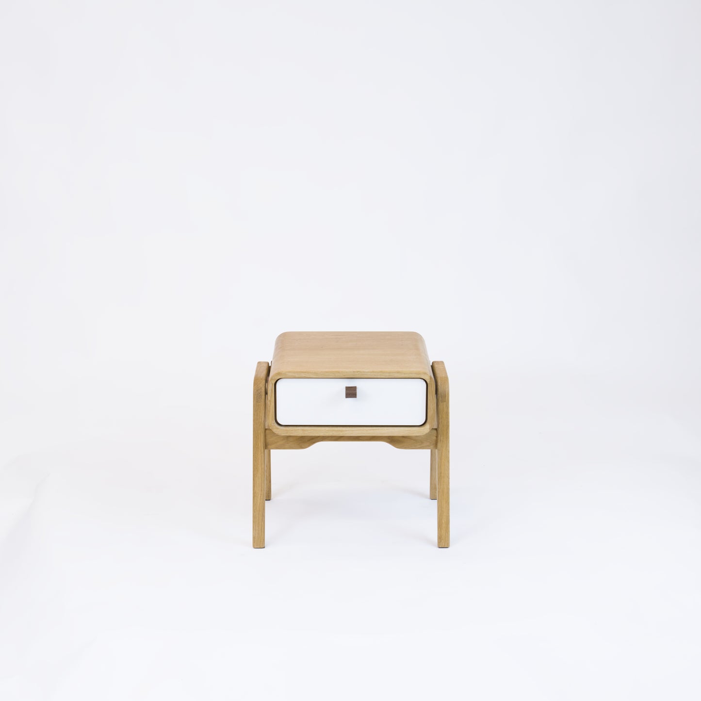 Low nightstand nm11L. The main corpus is crafted from solid Norwegian oak, featuring 1 drawer with white front.