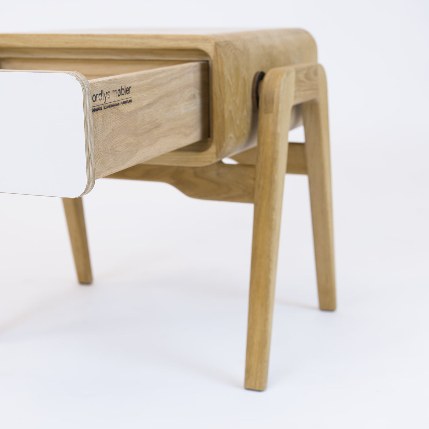 Low nightstand nm11L. The main corpus is crafted from solid Norwegian oak, featuring 1 drawer with white front.