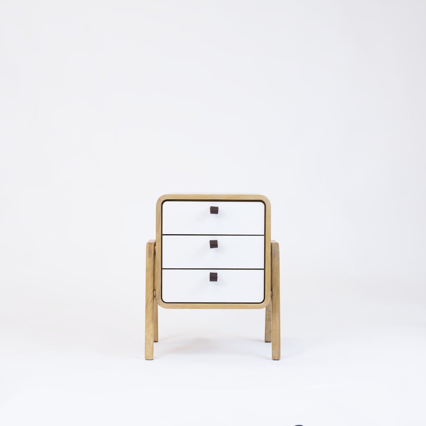 Low nightstand nm31L. The main corpus is crafted from solid Norwegian oak, featuring 3 drawers with white front.