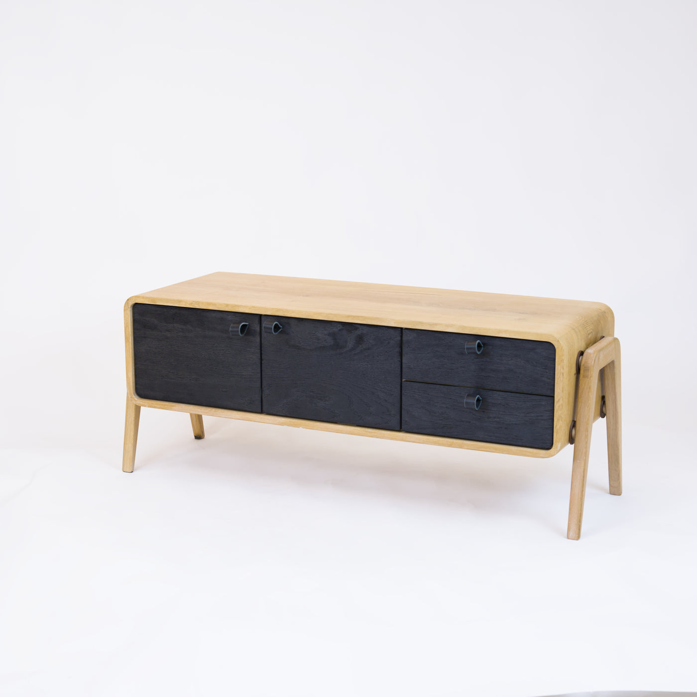 Low sideboard nm23L. The main corpus is crafted from solid Norwegian oak, featuring 2 doors and 2 right drawers, all with black oak fronts.
