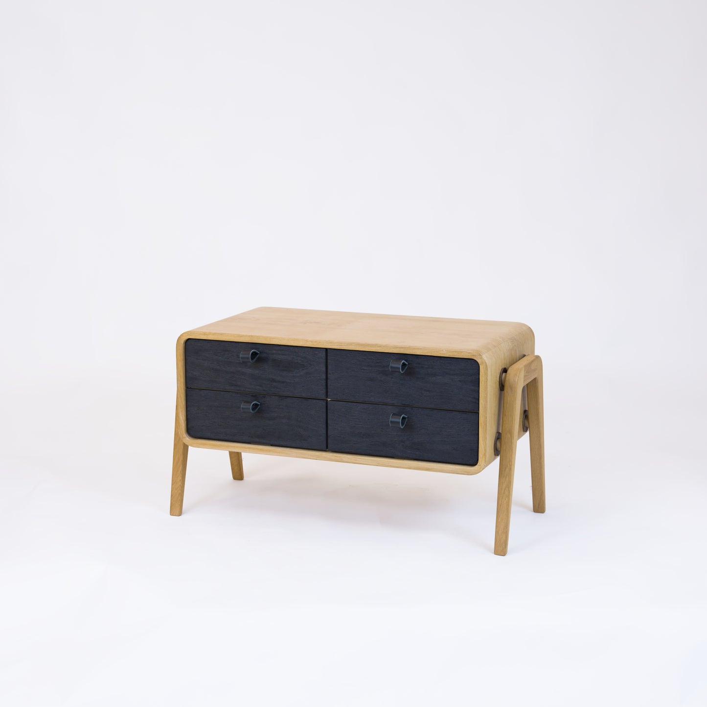 Low sideboard nm22L. The main corpus is crafted from solid Norwegian oak, featuring 4 drawers with black oak fronts.