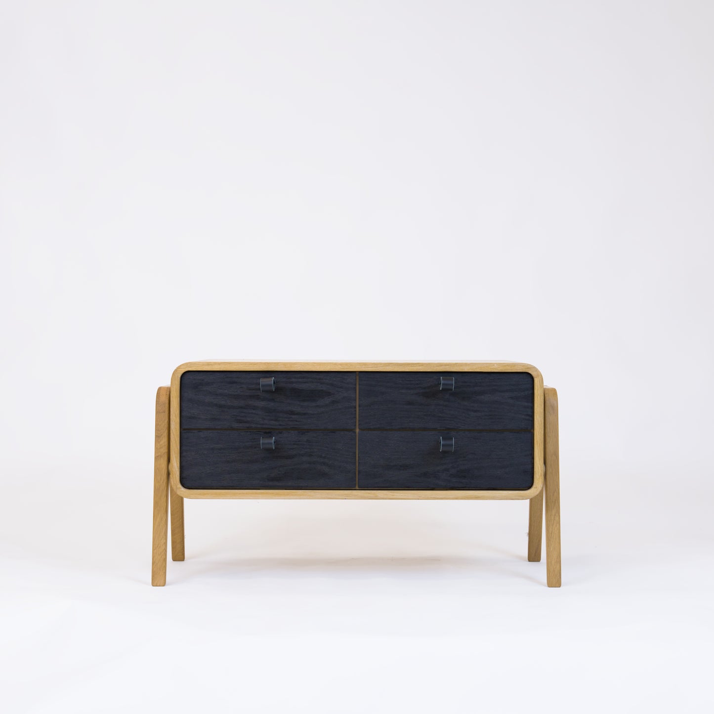 Low sideboard nm22L. The main corpus is crafted from solid Norwegian oak, featuring 4 drawers with black oak fronts.