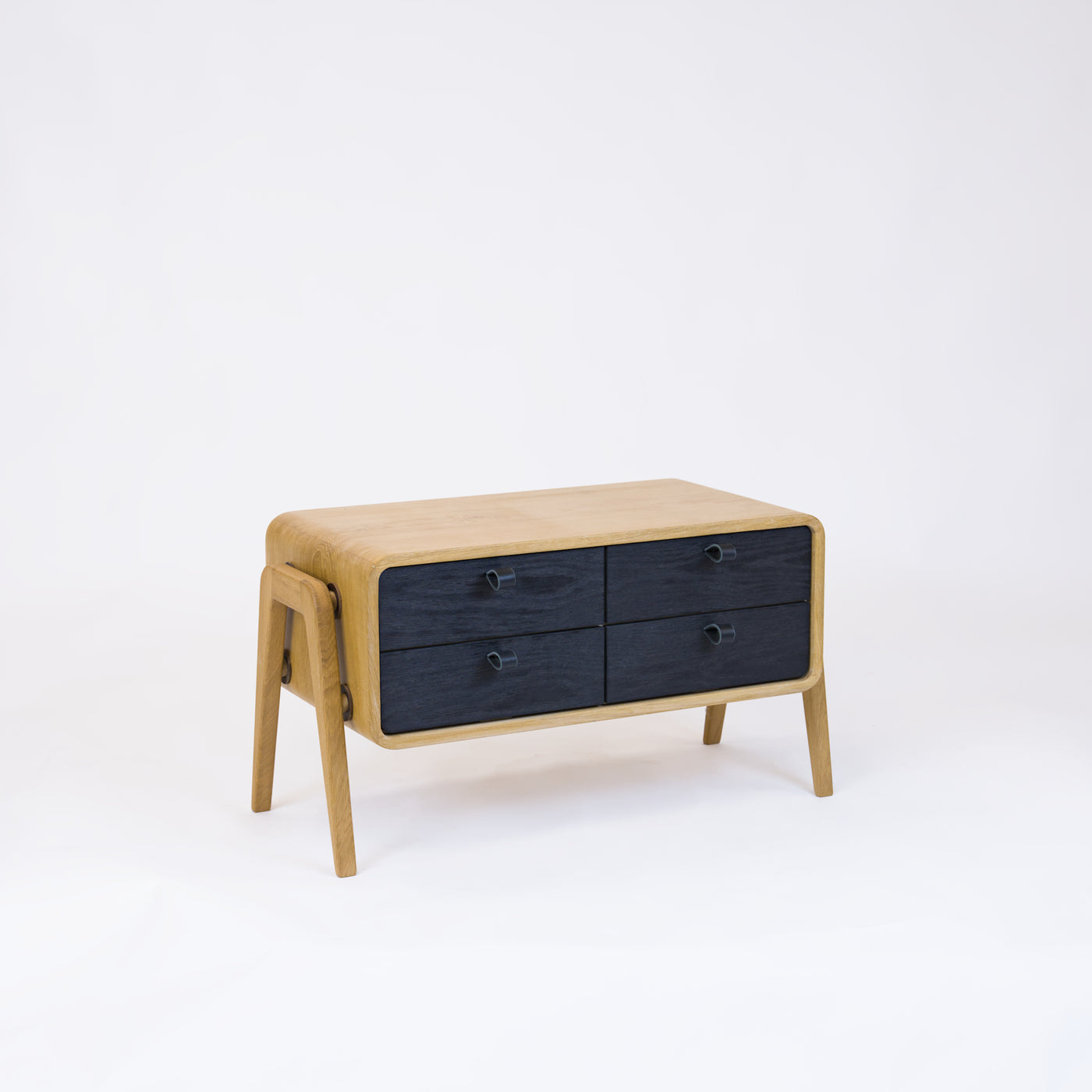 Low sideboard nm22L. The main corpus is crafted from solid Norwegian oak, featuring 4 drawers with black oak fronts.