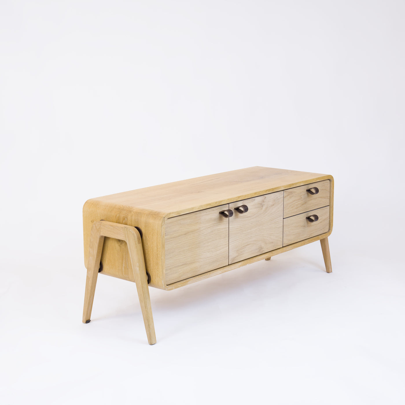 Low sideboard nm23L. The main corpus is crafted from solid Norwegian oak, featuring 2 doors and 2 right drawers, all with natural oak fronts.