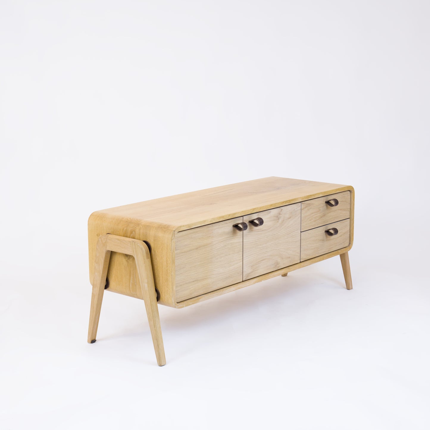 Low sideboard nm23L. The main corpus is crafted from solid Norwegian oak, featuring 2 doors and 2 right drawers, all with natural oak fronts.