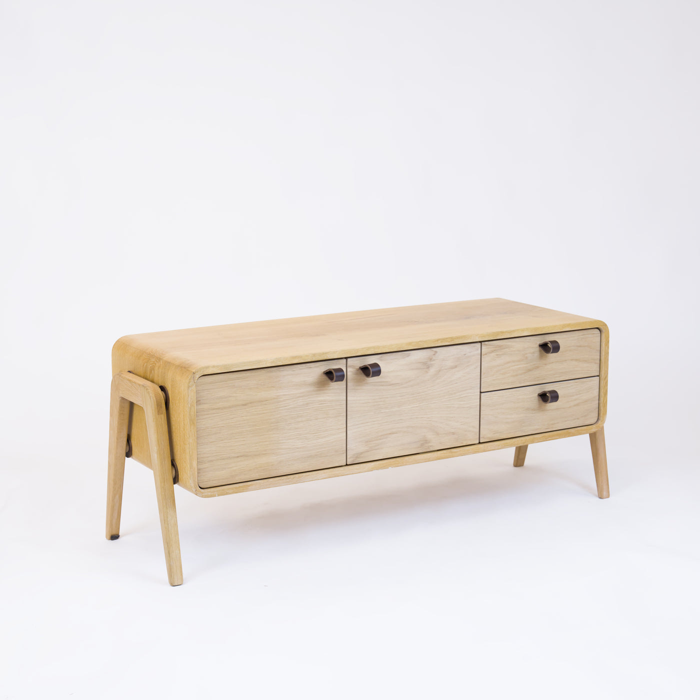Low sideboard nm23L. The main corpus is crafted from solid Norwegian oak, featuring 2 doors and 2 right drawers, all with natural oak fronts.