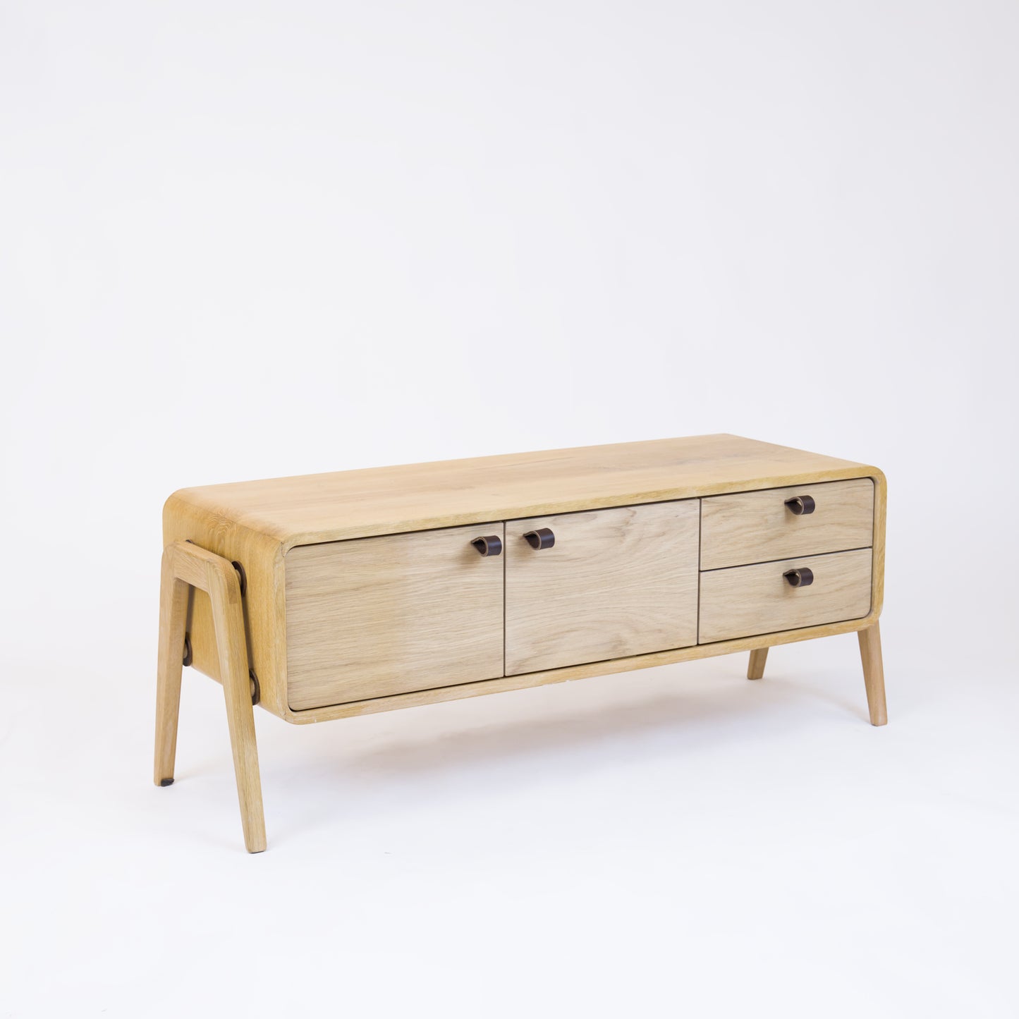 Low sideboard nm23L. The main corpus is crafted from solid Norwegian oak, featuring 2 doors and 2 right drawers, all with natural oak fronts.
