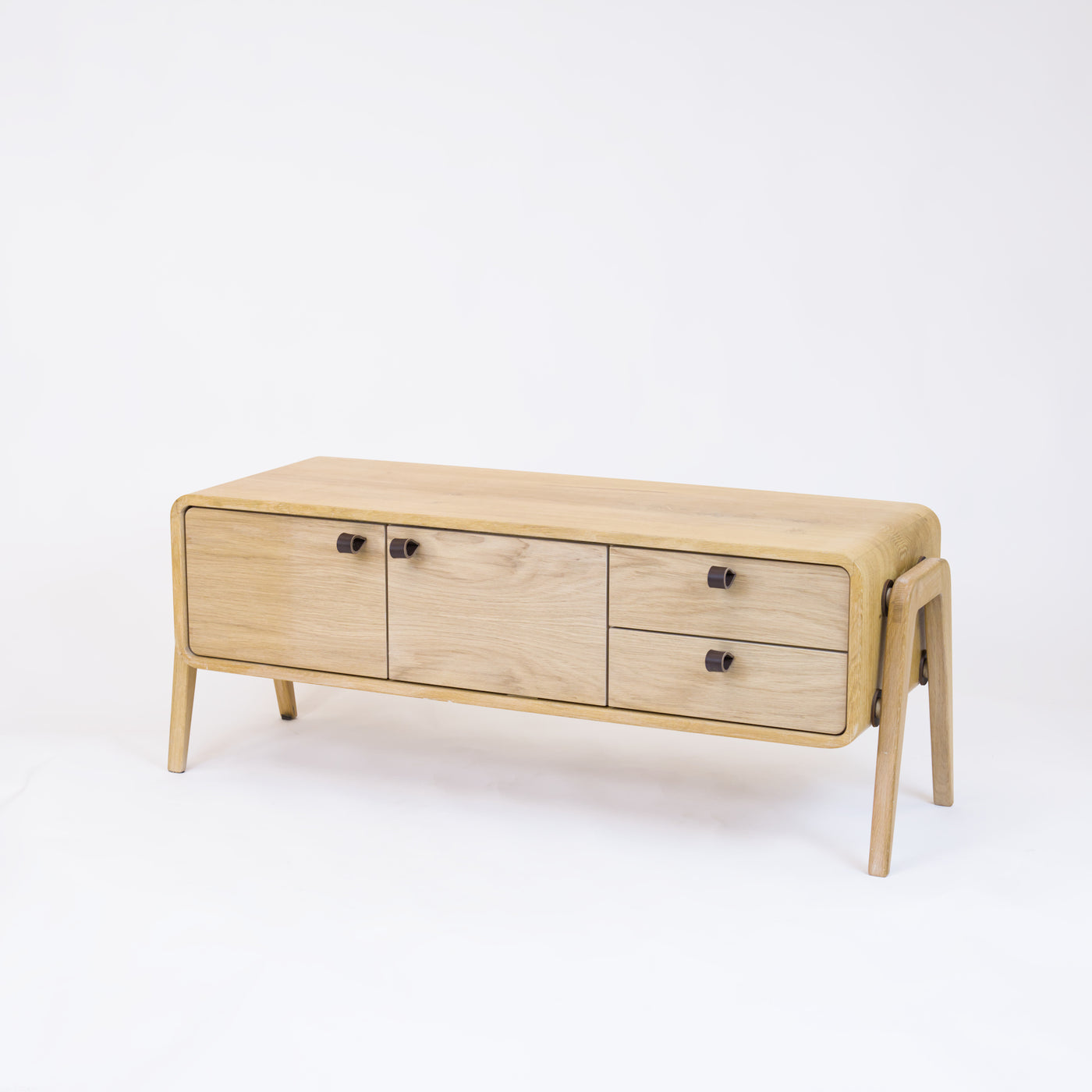 Low sideboard nm23L. The main corpus is crafted from solid Norwegian oak, featuring 2 doors and 2 right drawers, all with natural oak fronts.