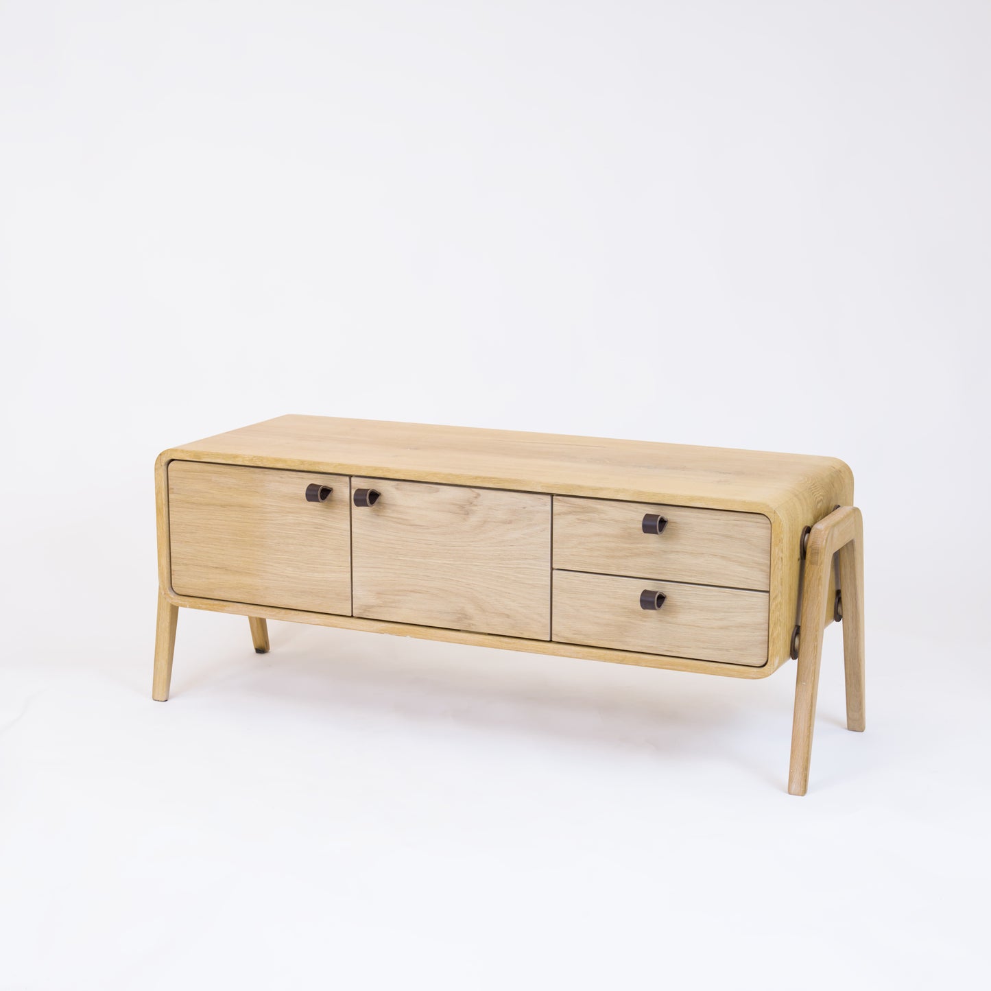 Low sideboard nm23L. The main corpus is crafted from solid Norwegian oak, featuring 2 doors and 2 right drawers, all with natural oak fronts.