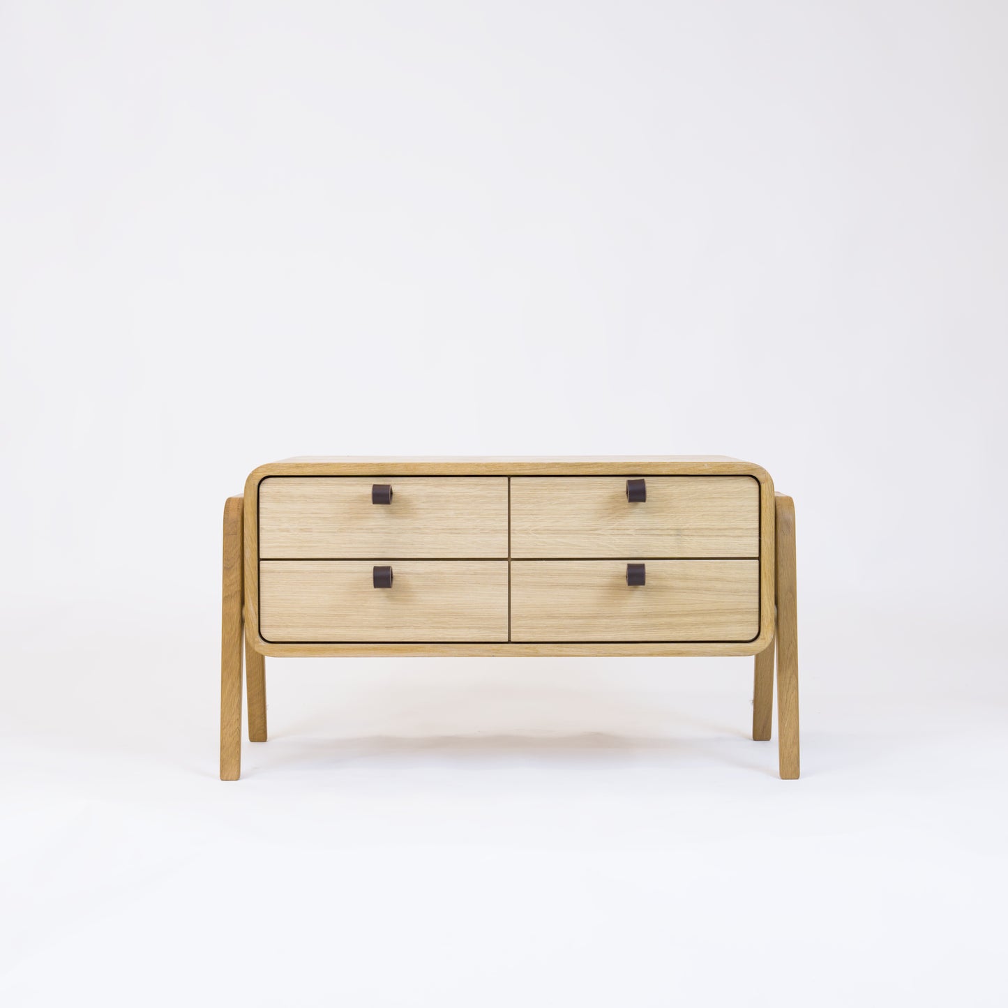 Low sideboard nm22L. The main corpus is crafted from solid Norwegian oak, featuring 4 drawers with natural oak fronts.
